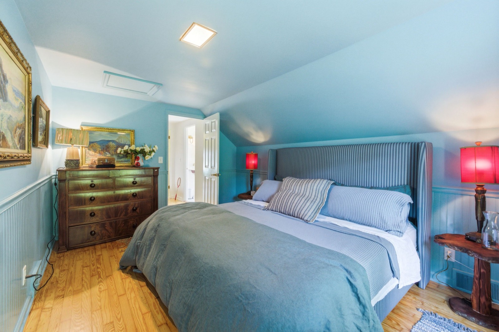 The Blue Room: king bed dressed in layers of blue on blue