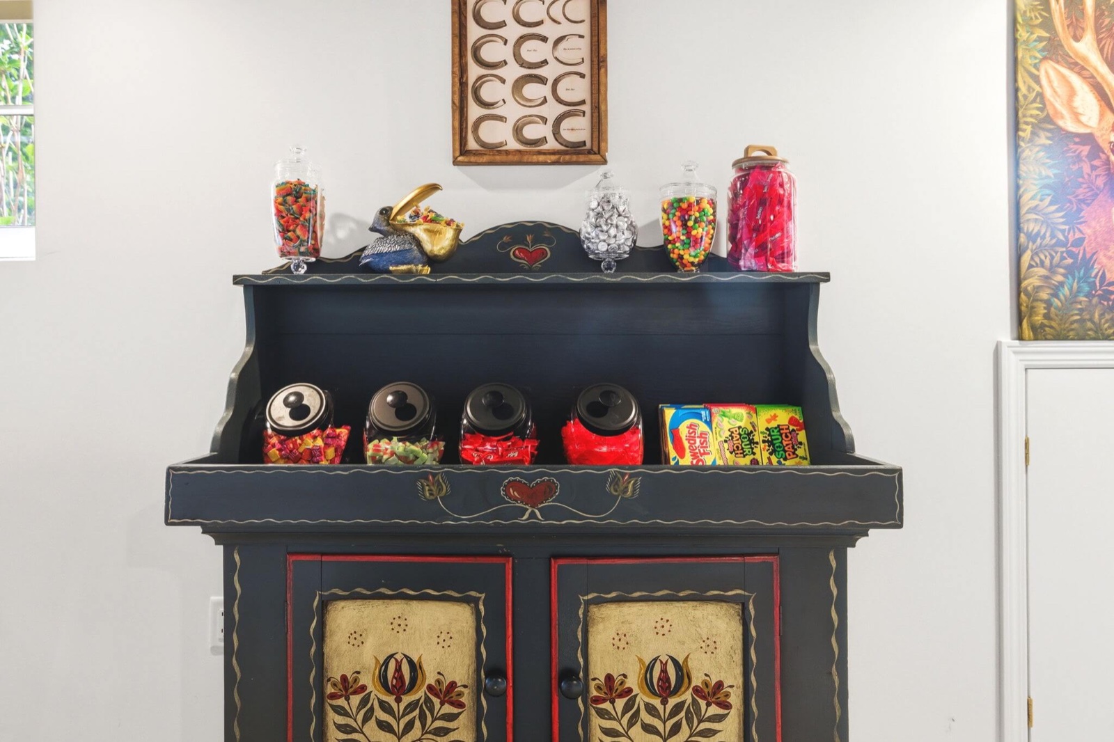 The hand-painted candy hutch stocked with jars of sweets and boxes of movie candy